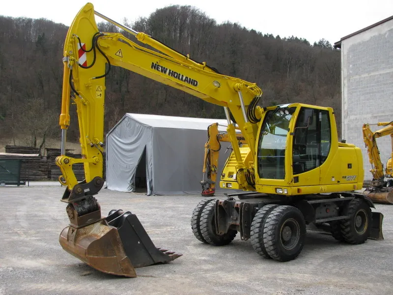 Bager točkaš New Holland MH PLUS sa POWERTILLT i 2 kašike
